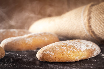hot pastries with burlap on the background of wooden boards