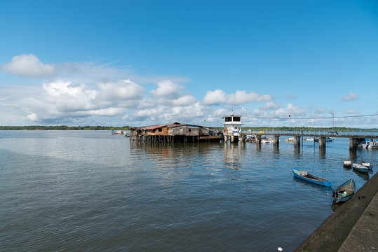 Port of transport of people with houses mounted on winged wooden piles of the transit bridge. Buenaventura Colombia.