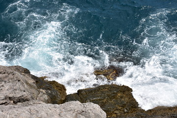 waves crashing on rocks