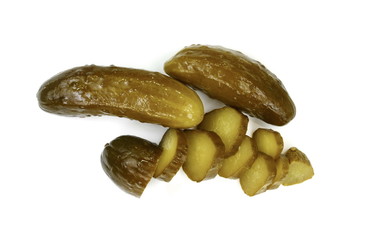pickled or marinated cucumbers isolated on white background. Fresh sliced green pickles. 