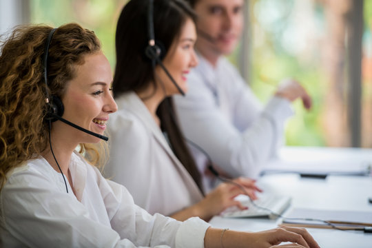 Cute young businessmen and colleagues in the call center office