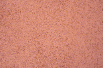 Empty background. Orange wall, porous texture.
