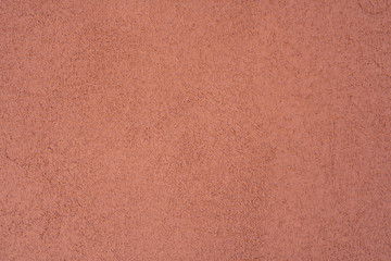 Fototapeta premium Empty background. Orange wall, porous texture.