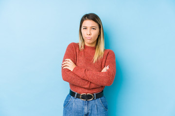 young caucasian woman posing isolated frowning face in displeasure, keeps arms folded.