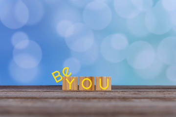Inspirational quote - Be you. The real you with  creative words design on wooden cubes on soft...