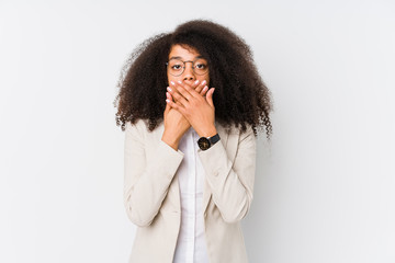 Young african american business woman shocked covering mouth with hands.