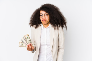 Young afro business woman holding a credit car isolated Young afro business woman holding a credit...