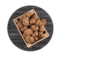 Wooden crate full of fresh raw potatoes of an unusual shape. The concept is food waste reduction. Banner. Collage. The trend towards the use of ugly fruits and vegetables.