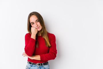 Young caucasian woman posing isolated  who feels sad and pensive, looking at copy space.