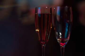 a neon two champagne glasses 