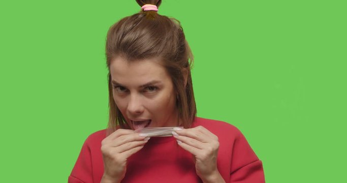 female rolling cannabis joint