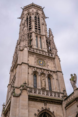 The tower of Saint-Germain L'Auxerrois. It is a Roman Catholic church in Paris situated at 2 Place du Louvre. Founded in the 7th century, the church was rebuilt many times over several centuries.  - 321370626