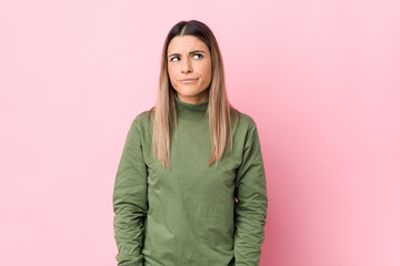 Fototapeta premium Young caucasian woman isolated confused, feels doubtful and unsure.