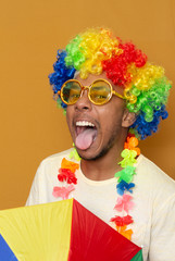 beautiful man using a colored wig  yellow glasses screaming out