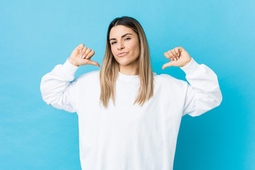 Young caucasian woman isolated feels proud and self confident, example to follow.