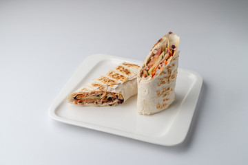 Turkish shawarma cut in halves isolated on white background