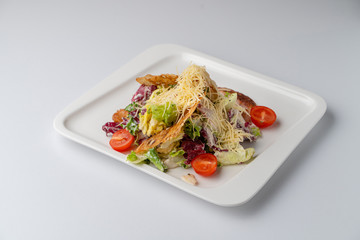 Classic caesar salad isolated on white background
