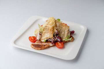 Classic caesar salad isolated on white background
