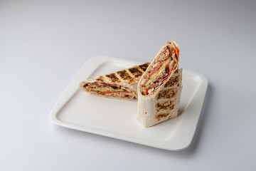 Turkish shawarma cut in halves isolated on white background