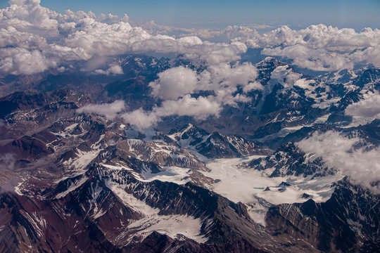 andes mountain range snow view airplane drone photo chile south america patagonia aerial photography in the sky in the clouds photo jovani prochnov