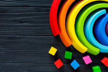 Colorful wooden toy rainbow, arc rainbow for children, toys for creativity  development. Children's waldorf or montessori school concept. Educational games for kindergarten, preschool kids
