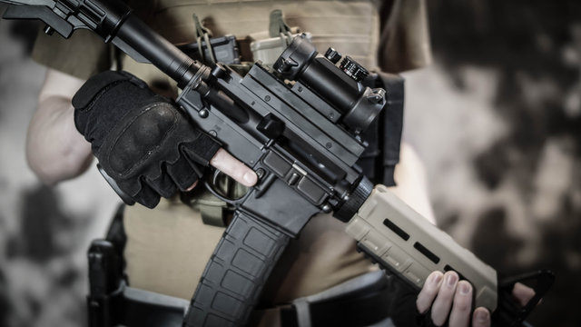 Armed Security contractor holding AR15 Rifle