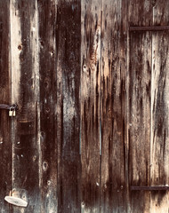 Dark grunge wood door with lock texture background vertical line, abstract background with copy space