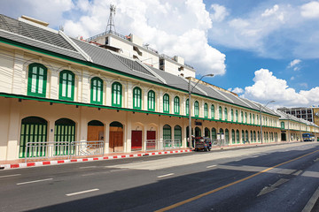 Outdoor modern vintage building style architecture wall with clear sky and cloudy background in Bangkok Thailand