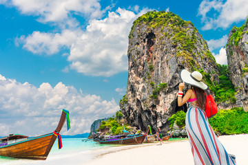 Lifestyle traveler woman stand on famous beach look joy beautiful nature scenic landscape Ao Nang beach Krabi, Girl travel summer holidays Phuket Thailand, Tourism destination place Asia vacation trip