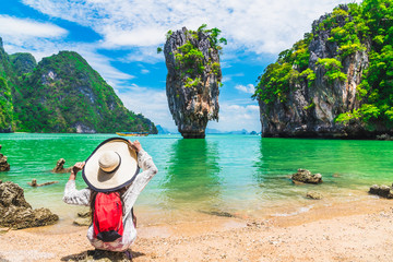 Stunning amazed nature scenic landscape with traveler woman on beach look joy James Bond island Famous landmark travel Phuket Thailand Tourism beautiful destination Asia Summer holidays vacation trips