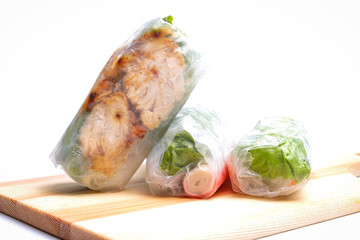 High key photo of Gỏi cuốn  or Vietnamese spring roll on slate plate. Traditional Vietnamese consisting of meat, prawn, vegetables, rice vermicelli and other ingredients wrapped in rice paper.