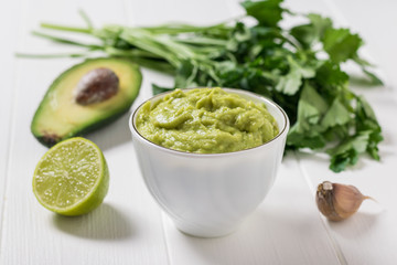 Guacamole with lime and spicy herbs. Diet vegetarian Mexican food avocado.