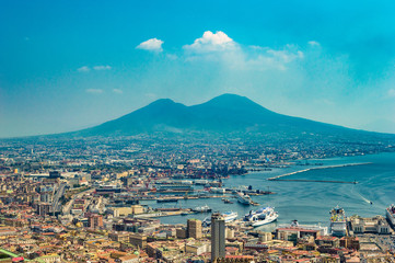Fototapeta na wymiar Naples, Italy - CIRCA 2013: Aerial/bird eye view of the city of Naples, Italy. The Bay of Naples and Mount Vesuvius are visible. Taken at a sunny summer day.