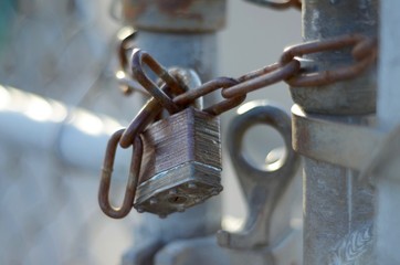Padlock on a school yard fence