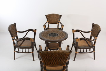 In some Asian countries and China, craftsmen use cane or wicker furniture on a white background. It...