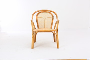 In some Asian countries and China, craftsmen use cane or wicker furniture on a white background. It...