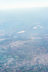 Amsterdam Schiphol,, a view of a large body of water with a mountain in the background