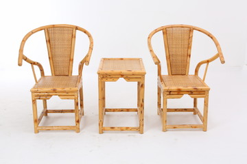 In some Asian countries and China, craftsmen use cane or wicker furniture on a white background. It...