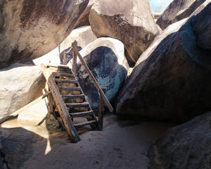 The Baths in Virgin Gorda BVI with rock formations that are beautifully complimented with the blue water surrounding them. 