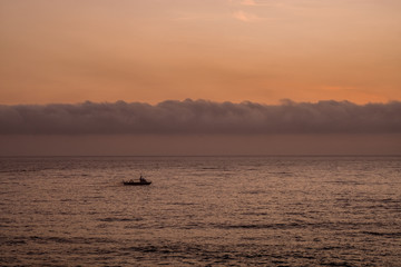 boat and clouds at dawn