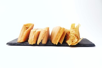 Apam balik or Malay pancake on a plate isolated on white