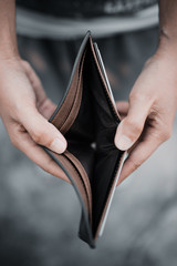Empty money in wallet and unemployment concept.