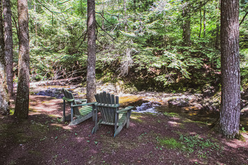 Couple of adirondack chairs at the cottage