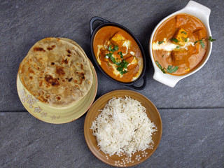 Top down view of Paneer Butter Masala , a rich and creamy Indian dish made of Paneer or Tofu in tomato and cream gravy.