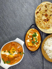 Top down view of Paneer Butter Masala , a rich and creamy Indian dish made of Paneer or Tofu in tomato and cream gravy.
