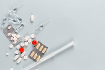 Medicine on a blue background, top view, copy space for text.