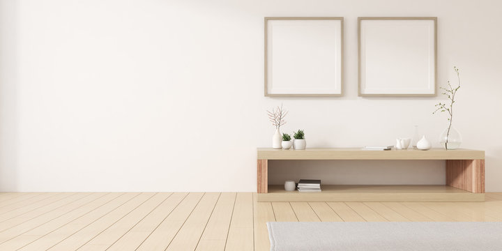 View of white living room in minimal style with white blank picture frame and small timber cabinet on wood laminate floor.Perspective of interior design. 3d rendering.	