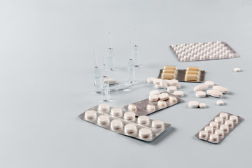 Medicine on a blue background, top view, copy space for text.