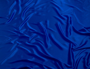 BLUE SILKY CLOTH WITH FOLDS BACKGROUND