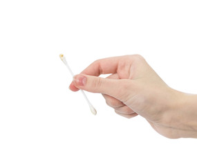 Hand holding a dirty cotton swab. Close up. Isolated on a white background